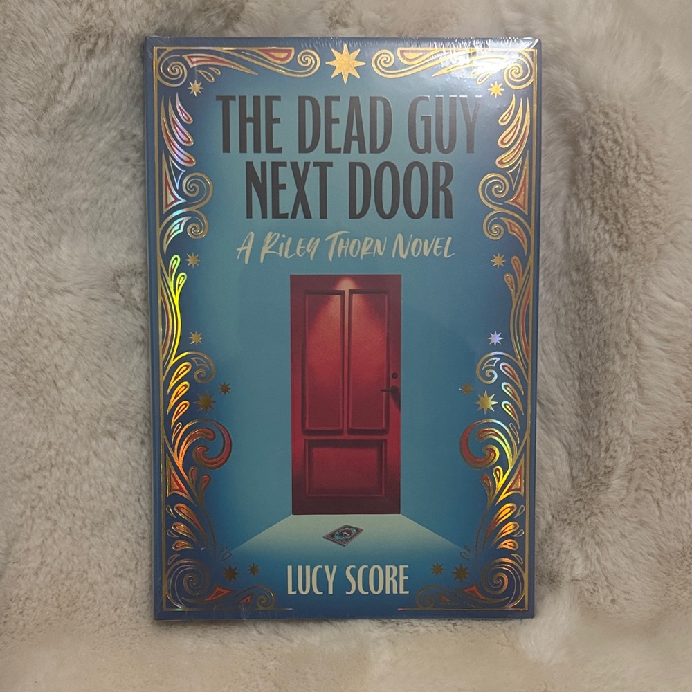 The Dead Guy Next Door Book by Lucy Score
